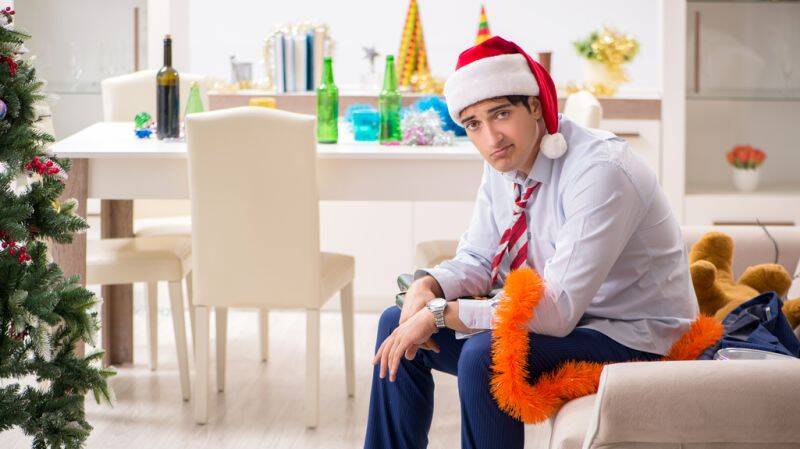 Inspirational image showing a festive holiday scene with a planner and pen, symbolizing goal setting for personal and client growth in the new year