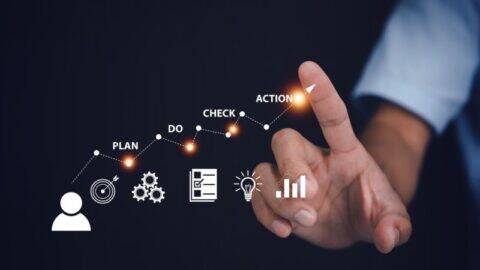 A financial advisor reviewing investment reports, symbolising strategic decision-making and the benefits of partnering with an EAM.