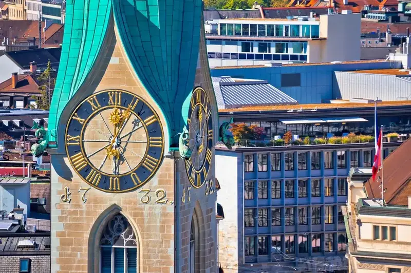 Zurich clock tower representing Wealth Management in Switzerland and financial expertise.